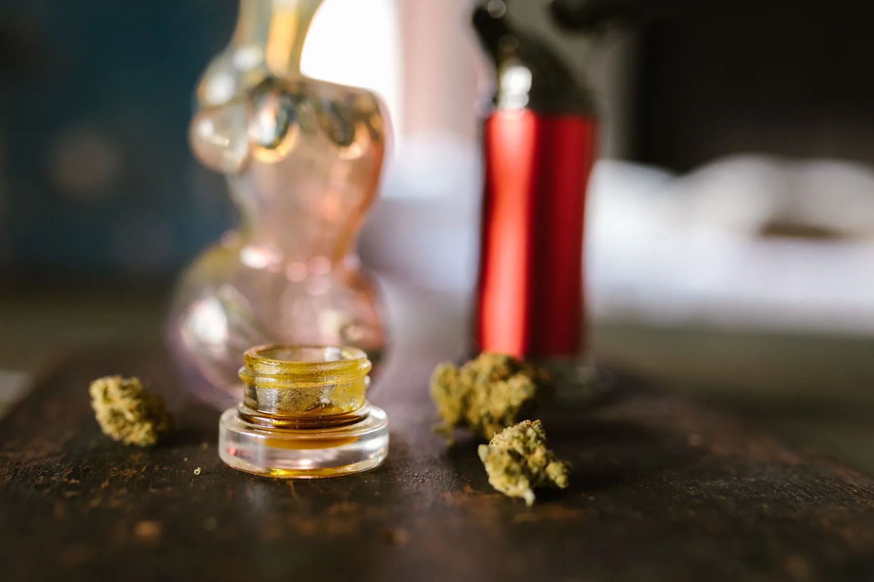 Dab tool lifting a portion of golden hemp concentrate